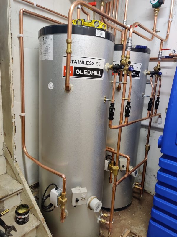 Two boilers installed with copper pipe connections in South London